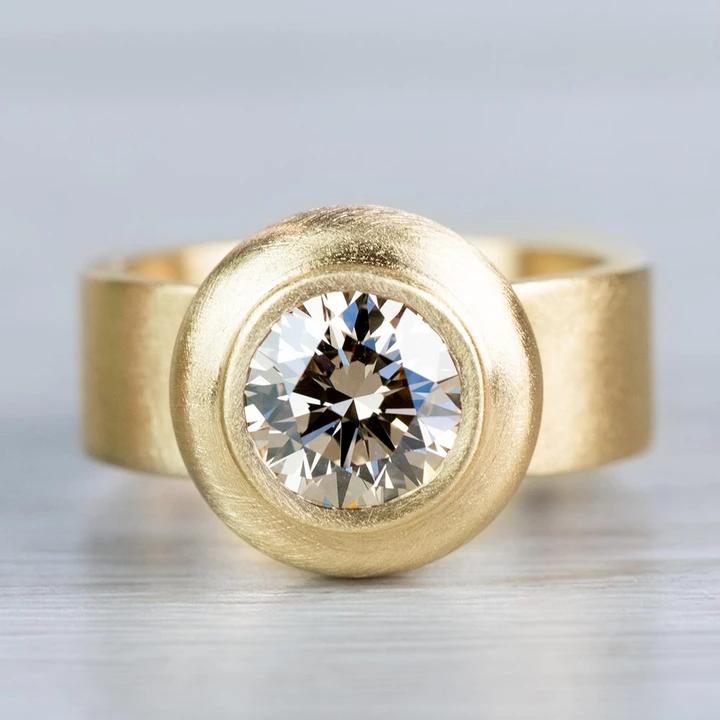 Golden Orbit Bezel-Set Ring – Sleek Radiance Collection